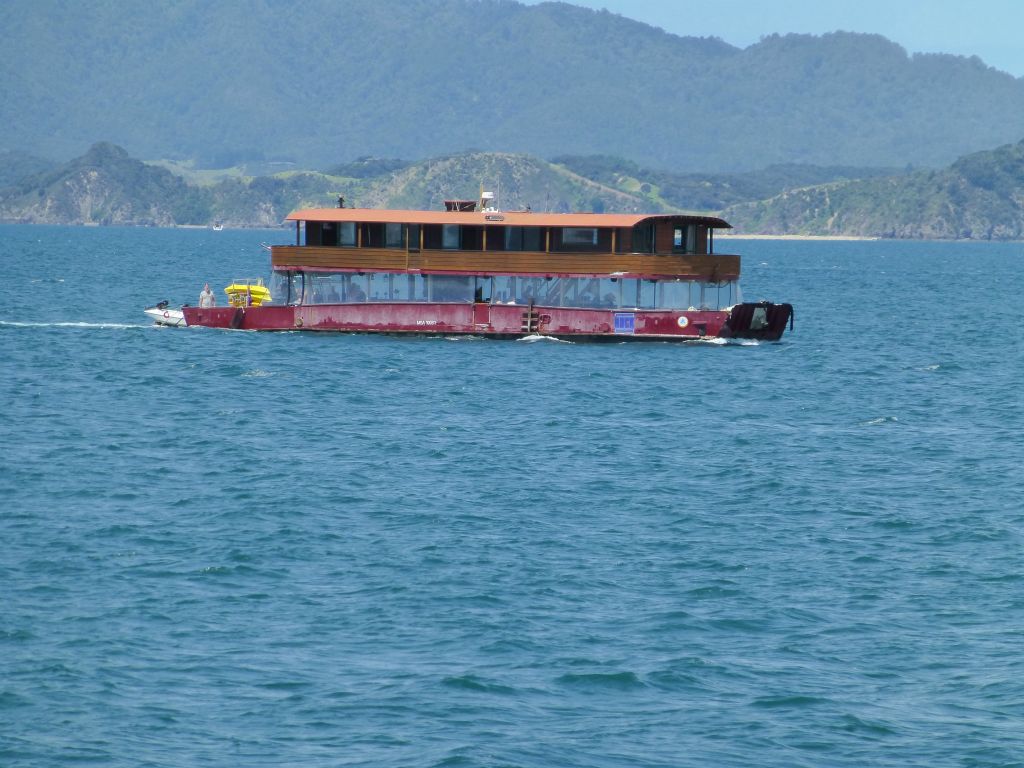 The renowned 'Hole in the Rock' cruise aboard Fullers.  Bay of Islands.